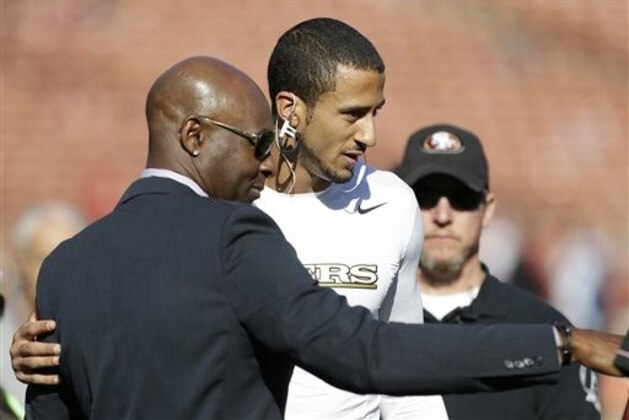 San Francisco 49ers quarterback Colin Kaepernick, right, poses for photographs with former wide receiver Jerry Rice before an NFL football game against the St. Louis Rams in San Francisco, Sunday, Dec. 1, 2013. (AP Photo/Tony Avelar)