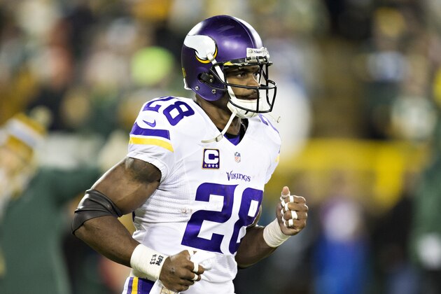 GREEN BAY, WI - JANUARY 3:  Adrian Peterson #28 of the Minnesota Vikings runs onto the field before a game against the Green Bay Packers at Lambeau Field on January 3, 2016 in Green Bay, Wisconsin.  The Vikings defeated the Packers 20-13.  (Photo by Wesley Hitt/Getty Images)