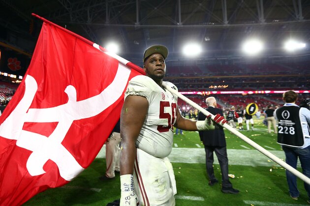 Jan 11, 2016; Glendale, AZ, USA; Alabama Crimson Tide offensive lineman Alphonse Taylor (50) walks around the field with a team flag after the 2016 CFP National Championship against the Clemson Tigers at University of Phoenix Stadium. Mandatory Credit: Mark J. Rebilas-USA TODAY Sports Jan 11, 2016; Glendale, AZ, USA; Alabama Crimson Tide offensive lineman Alphonse Taylor (50) walks around the field with a team flag after the 2016 CFP National Championship against the Clemson Tigers at University of Phoenix Stadium. Mandatory Credit: Mark J. Rebilas-USA TODAY Sports