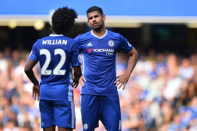Chelsea's Brazilian midfielder Willian (L) talks with Chelsea's Brazilian-born Spanish striker Diego Costa during the English Premier League football match between Chelsea and Burnley at Stamford Bridge in London on August 27, 2016. / AFP / GLYN KIRK / RESTRICTED TO EDITORIAL USE. No use with unauthorized audio, video, data, fixture lists, club/league logos or 'live' services. Online in-match use limited to 75 images, no video emulation. No use in betting, games or single club/league/player publications.  /         (Photo credit should read GLYN KIRK/AFP/Getty Images)