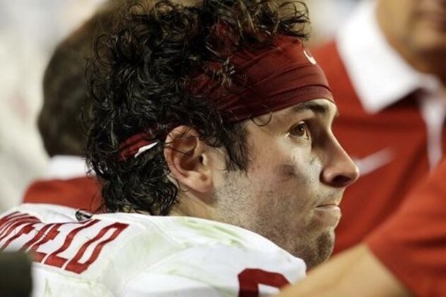 Oklahoma quarterback Baker Mayfield (6) looks up from the sidelines during the second half of the Orange Bowl NCAA college football semifinal playoff game against Clemson, Thursday, Dec. 31, 2015, in Miami Gardens, Fla. Clemson defeated Oklahoma 37-17 to advance to the championship game. (AP Photo/Lynne Sladky)