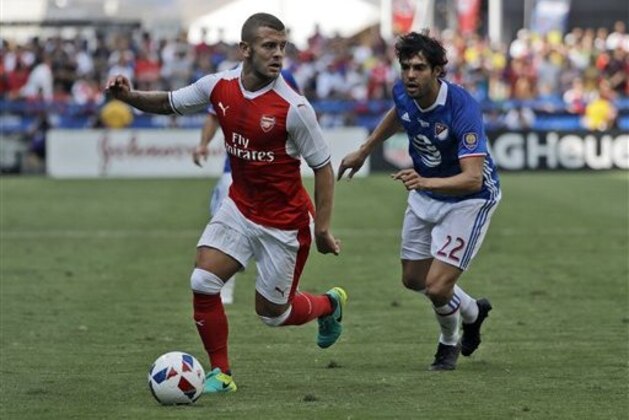 Arsenal midfielder Jack Wilshere, left, controls the ball next to MLS All-Stars' Kaka during the first half of the MLS All-Star soccer game Thursday, July 28, 2016, in San Jose, Calif. (AP Photo/Marcio Jose Sanchez)