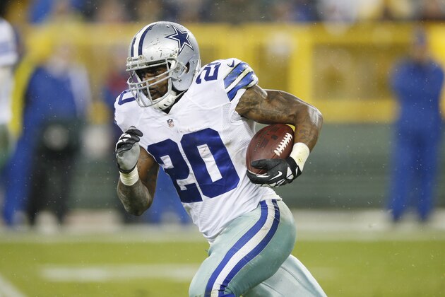 GREEN BAY, WI - DECEMBER 13: Darren McFadden #20 of the Dallas Cowboys runs the ball against the Green Bay Packers during the game at Lambeau Field on December 13, 2015 in Green Bay, Wisconsin. The Packers defeated the Cowboys 28-7. (Photo by Joe Robbins/Getty Images)