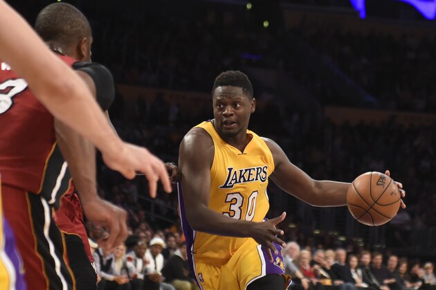 Mar 30, 2016; Los Angeles, CA, USA; Los Angeles Lakers forward Julius Randle (30) drives to the basket against the Miami Heat defense during the second half at Staples Center. Mandatory Credit: Richard Mackson-USA TODAY Sports