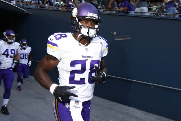 Aug 18, 2016; Seattle, WA, USA; Minnesota Vikings running back Adrian Peterson (28) runs out of the locker room for pre game warmups against the Seattle Seahawks at CenturyLink Field. Mandatory Credit: Joe Nicholson-USA TODAY Sports