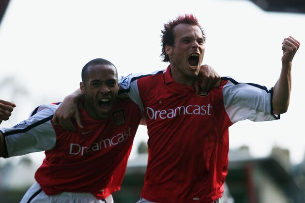LONDON - APRIL 21:  Fredrik Ljungberg of Arsenal celebrates scoring his second goal with Thierry Henry of Arsenal during the FA Barclaycard Premiership match between Arsenal and Ipswich Town held on April 21, 2002 at Highbury in London, England.  Arsenal won the match 2-0.  (Photo by Phil Cole/Getty Images)