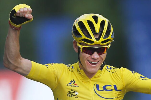 2016 Tour de France winner Chris Froome of Britain celebrates as he crosses the finish line of the twenty-first stage of the Tour de France cycling race over 113 kilometers (70.2 miles) with start in Chantilly and finish in Paris, France, Sunday, July 24, 2016. (AP Photo/Peter Dejong)