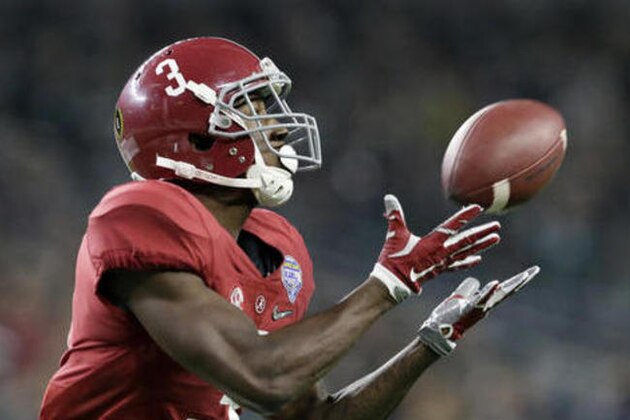 FILE - In this Dec. 31, 2015, file photo, Alabama wide receiver Calvin Ridley (3) makes a touchdown reception against Michigan State during the second half of the Cotton Bowl NCAA college football semifinal playoff game, in Arlington, Texas. Whoever emerges as Alabama's quarterback will have targets galore, starting with star receiver Calvin Ridley and tight end O.J. Howard.  (AP Photo/LM Otero, File)