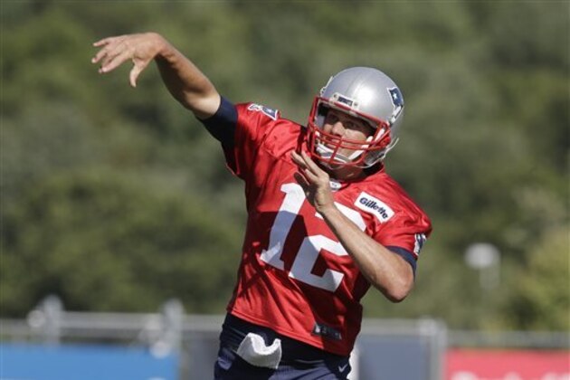 New England Patriots quarterback Tom Brady follows through on a pass during an NFL football training camp practice, Tuesday, Aug. 30, 2016, in Foxborough, Mass. (AP Photo/Steven Senne)