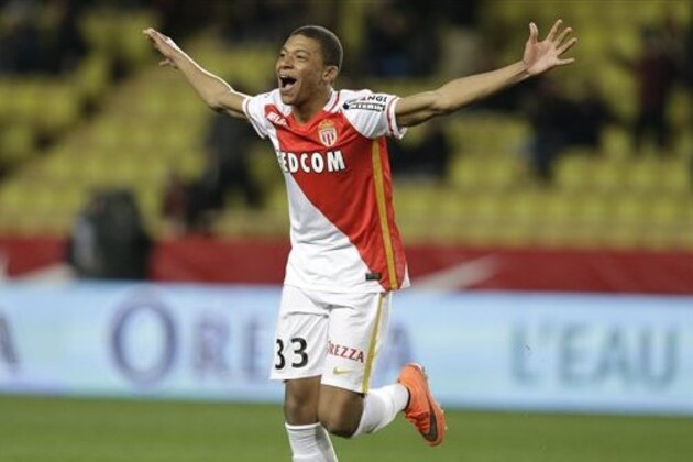 Monaco's Kylian Mbappe Lottin reacts after scoring the third goal against Troyes during their French League One soccer match, Saturday, Feb. 20, 2016, in Monaco. (AP Photo/Lionel Cironneau)