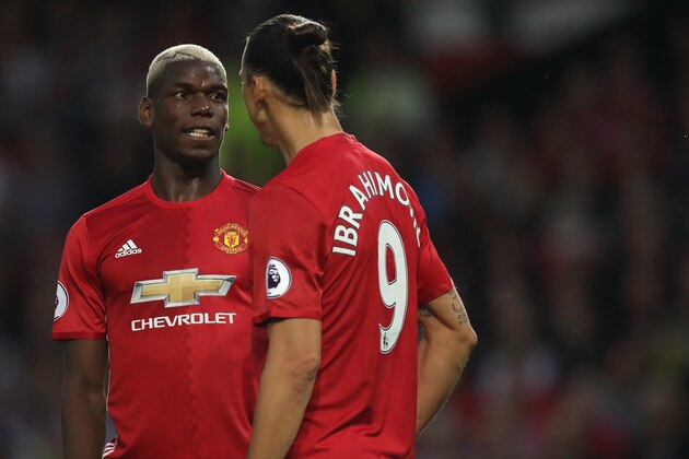 MANCHESTER, ENGLAND - AUGUST 19: Paul Pogba and Zlatan Ibrahimovic of Manchester United during the Premier League match between Manchester United and  Southampton at Old Trafford on August 19, 2016 in Manchester, England. (Photo by Matthew Ashton - AMA/Getty Images)