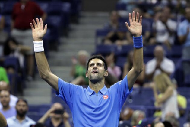 Novak Djokovic, of Serbia, waves after defeating Jerzy Janowicz, of Poland, during the first round of the US Open tennis tournament, Monday, Aug. 29, 2016, in New York. (AP Photo/Darron Cummings)
