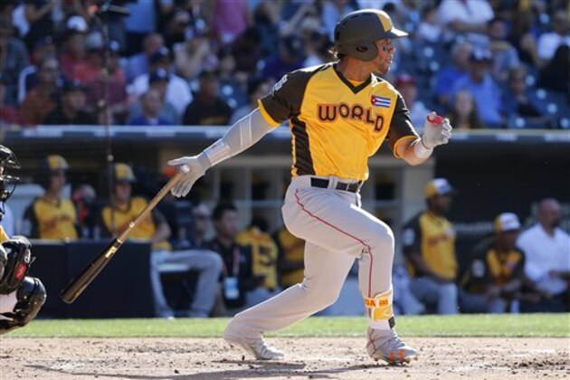 World Team's Yoan Moncada, of the Boston Red Sox, hits against the U.S. Team during the XXX inning of the All-Star Futures baseball game, Sunday, July 10, 2016, in San Diego. (AP Photo/Lenny Ignelzi)