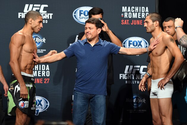 HOLLYWOOD, FL - JUNE 26:  Hacran Dias of Brazil (L) and Levan Makashvili (R) are separated by UFC matchmaker Joe Silva (C) during the UFC weigh-in at the Seminole Hard Rock Casino on June 26, 2015 in Hollywood, Florida. (Photo by Josh Hedges/Zuffa LLC/Zuffa LLC via Getty Images)