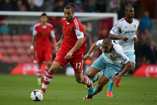 Southampton's Argentinian-born Italian striker Dani Osvaldo (L) dribbles past West Ham United's New Zealand defender Winston Reid (R) during English Premier League football match between Southampton and West Ham United at St Mary's Stadium in Southampton, southern England, on September 15, 2013. AFP PHOTO / ADRIAN DENNIS

RESTRICTED TO EDITORIAL USE. No use with unauthorized audio, video, data, fixture lists, club/league logos or 'live' services. Online in-match use limited to 45 images, no video emulation. No use in betting, games or single club/league/player publications.        (Photo credit should read ADRIAN DENNIS/AFP/Getty Images)