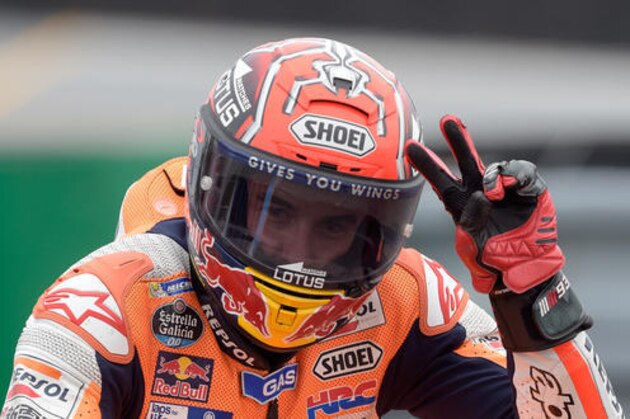 Moto GP rider Marc Marquez of Spain celebrates after finishing third in the Czech Republic Motorcycle Grand Prix in Brno, Czech Republic, Sunday, Aug. 21, 2016. (AP Photo/Jens Meyer)
