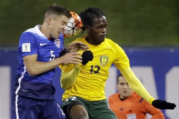 United States’ Matt Besler and St. Vincent and the Grenadines’ Tevin Slater vie for the ball during the first half of a 2018 World Cup qualifying soccer match Friday, Nov. 13, 2015, in St. Louis. (AP Photo/Jeff Roberson)