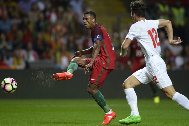 Portugal's forward Nani (L) shoots to score the opening goal during the friendly football match Portugal vs Gibraltar at Bessa stadium in Porto on September 1, 2016. / AFP / MIGUEL RIOPA        (Photo credit should read MIGUEL RIOPA/AFP/Getty Images)