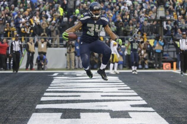Seattle Seahawks running back Thomas Rawls leaps in the air after scoring a touchdown against the Pittsburgh Steelers during an NFL football game, Sunday, Nov. 29, 2015, in Seattle. (AP Photo/Ted S. Warren)