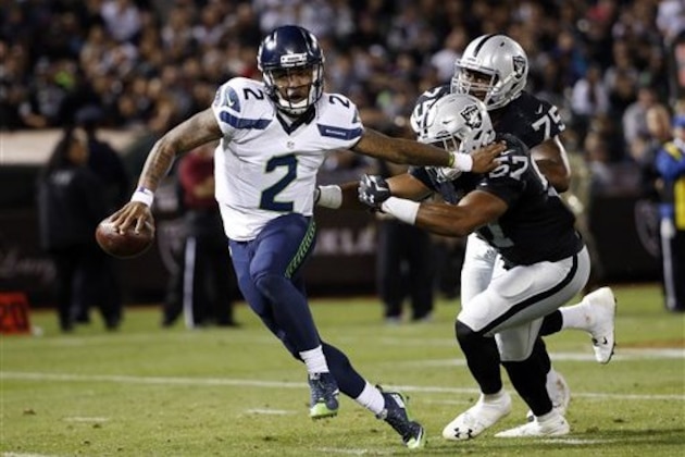 Seattle Seahawks quarterback Trevone Boykin (2) in action against the Oakland Raiders during the first half of a preseason NFL football game Thursday, Sept. 1, 2016, in Oakland, Calif. (AP Photo/Tony Avelar)
