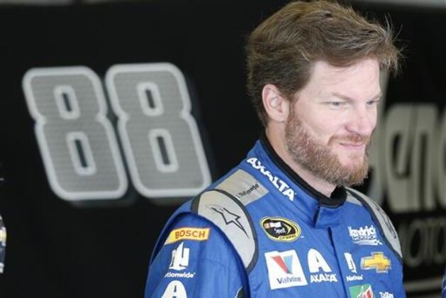 Dale Earnhardt Jr. prepares himself before the start of practice at Daytona International Speedway, Friday, July 1, 2016, in Daytona Beach, Fla., for Saturday night's NASCAR Sprint Cup Series auto race.  (AP Photo/Wilfredo Lee)
