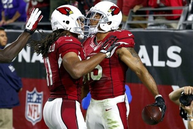 Arizona Cardinals wide receiver Michael Floyd (15) celebrates after scoring a touchdown against the Minnesota Vikings with Larry Fitzgerald (11) during the second half of an NFL football game, Thursday, Dec. 10, 2015, in Glendale, Ariz. (AP Photo/Ross D. Franklin)