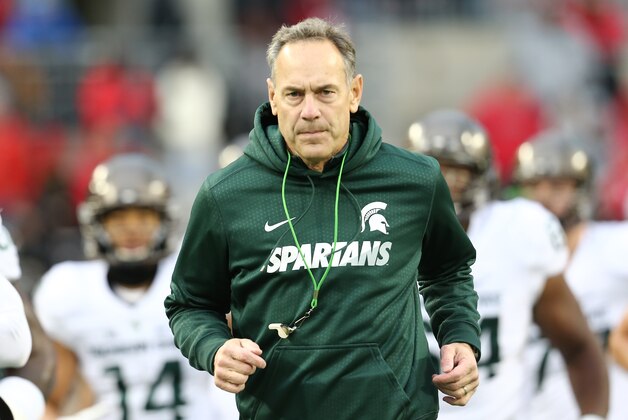 COLUMBUS, OH - NOVEMBER 21: Head coach Mark Dantonio of the Michigan State Spartans leads his team on to the field before the start of the game against Ohio State Buckeyes at Ohio Stadium on November 21, 2015 in Columbus, Ohio. (Photo by Rey Del Rio/Getty Images)