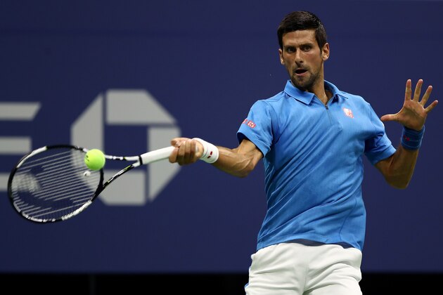NEW YORK, NY - AUGUST 29:  Novak Djokovic of Serbia & Montenegro returns a shot to Jerzy Janowicz of Poland during his first round Men's Singles match on Day One of the 2016 US Open at the USTA Billie Jean King National Tennis Center on August 29, 2016 in the Flushing neighborhood of the Queens borough of New York City.  (Photo by Elsa/Getty Images)