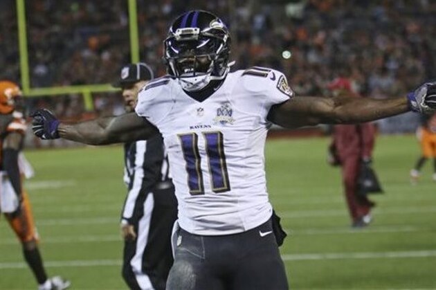 Baltimore Ravens wide receiver Kamar Aiken celebrates after scoring a 15-yard touchdown in the second half of an NFL football game against the Cleveland Browns, Monday, Nov. 30, 2015, in Cleveland. (AP Photo/Ron Schwane)