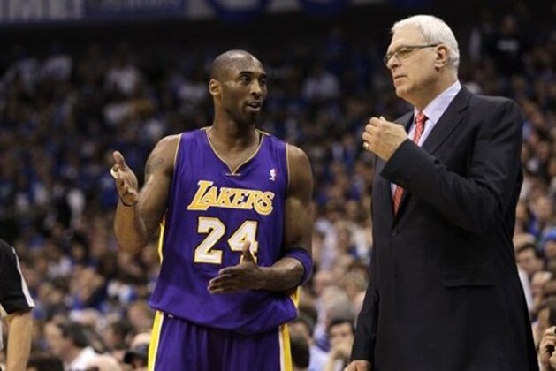 Los Angeles Lakers' Kobe Bryant (24) and head coach Phil Jackson, right, during Game 4 of a second-round NBA playoff basketball series against the Dallas Mavericks, Sunday, May 8, 2011, in Dallas. The Mavericks won 122-86.  (AP Photo/Tony Gutierrez)