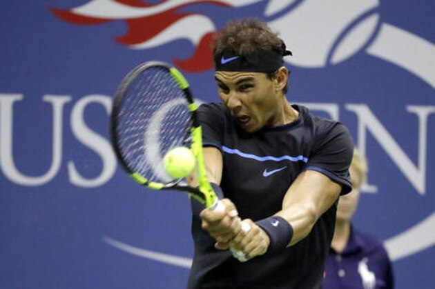Rafael Nadal, of Spain, returns a shot to Andrey Kuznetsov, of Russia, during the U.S. Open tennis tournament, Friday, Sept. 2, 2016, in New York. (AP Photo/Julio Cortez)