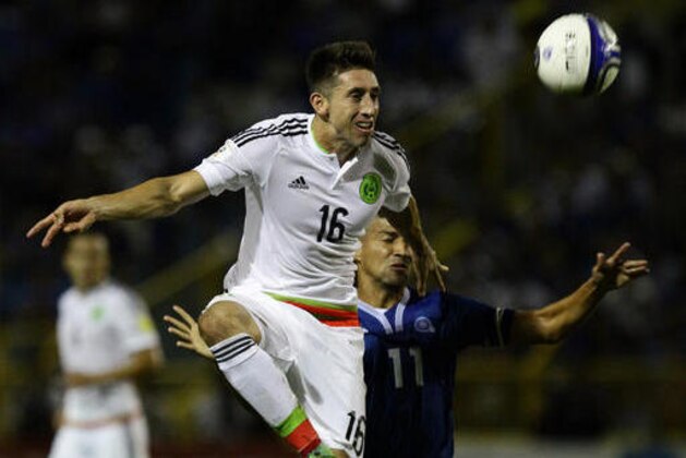 Mexico's Hector Herrera, left, fights for the ball with El Salvador's Nelson Bonilla during a 2018 World Cup qualifier soccer match in San Salvador, El Salvador, Friday, Sept. 2, 2016.(AP Photo/Salvador Melendez)
