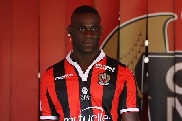 Nice's football club new signing Italian forward Mario Balotelli poses on September 2, 2016 at the Allianz Riviera stadium in Nice, southeastern France.
Wayward Italian striker Mario Balotelli has insisted that French club Nice have not taken a risk in signing him from Liverpool. 'The career that I have had, it's different to what has been written in the press,' Balotelli said at a press conference on Friday as he and fellow new signing Younes Belhanda, the French-born Moroccan international playmaker, were unveiled.  
 / AFP / VALERY HACHE        (Photo credit should read VALERY HACHE/AFP/Getty Images)