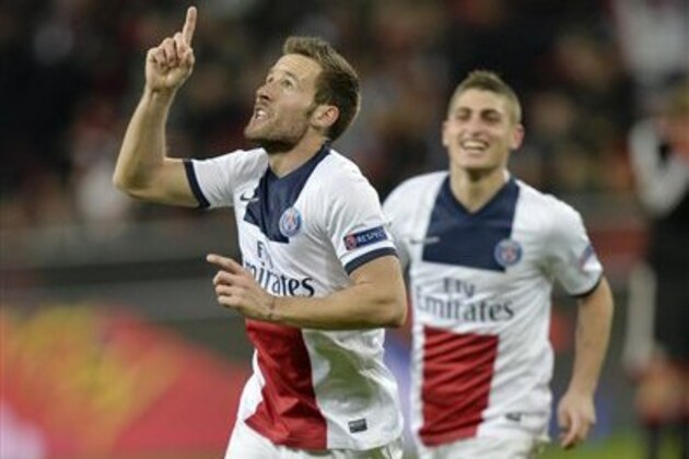 PSG's Yohan Cabaye, left, celebrate his side's fourth goal during a Champions League round of the last 16 first leg soccer match between Bayer Leverkusen and Paris Saint-Germain in Leverkusen, Germany, Tuesday Feb. 18, 2014.  (AP Photo/Martin Meissner)