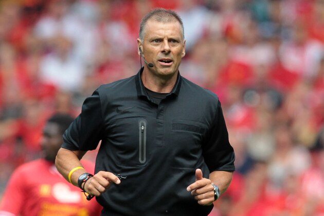 Referee Mark Halsey seen during the pre-season friendly football match between Liverpool and Olympiakos at Anfield Stadium in Liverpool, northwest England on August 3, 2013. The game is a testimonial match for Liverpool captain Steven Gerrard who recently signed a new two-year contract extension with Liverpool, the only club he has ever played for. AFP PHOTO/LINDSEY PARNABY        (Photo credit should read LINDSEY PARNABY/AFP/Getty Images)