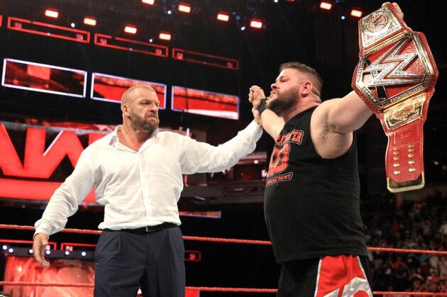 Kevin Owens celebrating his big win on Raw.