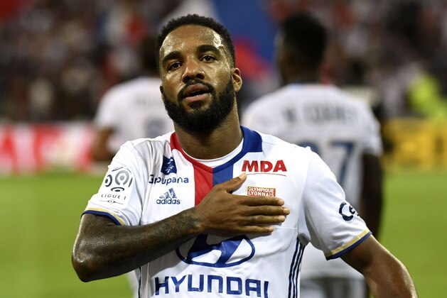 Lyon's French forward Alexandre Lacazette celebrates after scoring a goal during the French Ligue 1 football match Olympique Lyonnais (OL) against Caen (SMC) on August 19, 2016, at the Parc Olympique Lyonnais stadium in Decines-Charpieu near Lyon, southeastern France. / AFP / PHILIPPE DESMAZES        (Photo credit should read PHILIPPE DESMAZES/AFP/Getty Images)