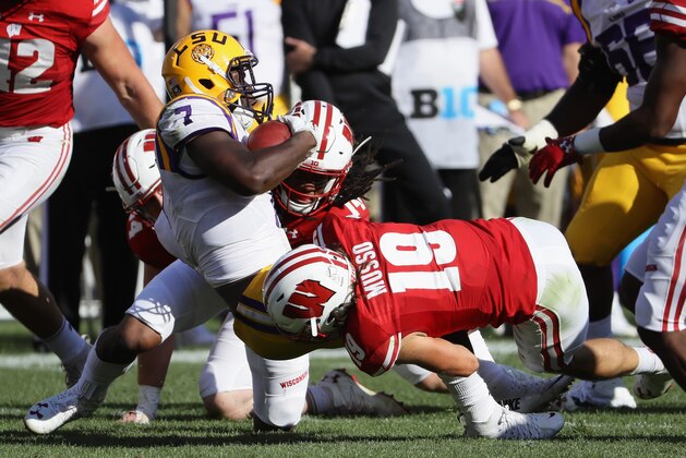 GREEN BAY, WI - SEPTEMBER 03:  Leo Musso #19 of the Wisconsin Badgers tackles Leonard Fournette #7 of the LSU Tigers during the second half of their game at Lambeau Field on September 3, 2016 in Green Bay, Wisconsin.  (Photo by Jonathan Daniel/Getty Images)