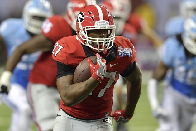 Sep 3, 2016; Atlanta, GA, USA;  Georgia Bulldogs running back Nick Chubb (27) runs for a touchdown against the North Carolina Tar Heels during the fourth quarter of the 2016 Chick-Fil-A Kickoff game at Georgia Dome. Mandatory Credit: Dale Zanine-USA TODAY Sports