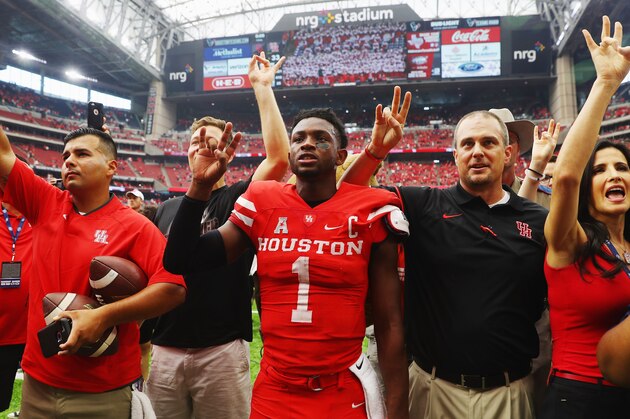 HOUSTON, TX - SEPTEMBER 03:  Quarterback Greg Ward Jr. #1 of the Houston Cougars celebrates with his coach Tom Herman after they defeated the Oklahoma Sooners 33-23 during the Advocare Texas Kickoff on September 3, 2016 in Houston, Texas.  (Photo by Scott Halleran/Getty Images)
