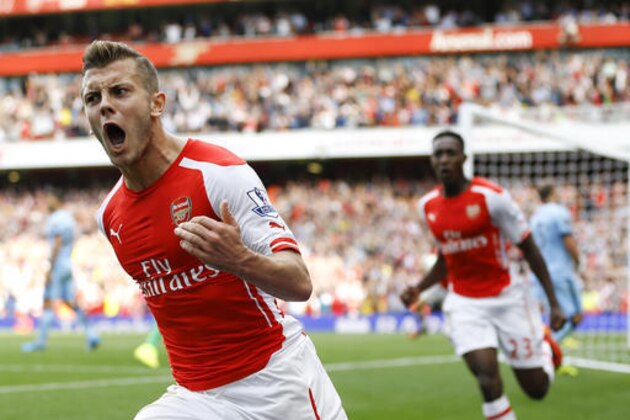 FILE - In this Saturday, Sept. 13, 2014 file photo, Arsenal's Jack Wilshere celebrates scoring a goal during the English Premier League soccer match between Arsenal and Manchester City at Emirates Stadium in London. Jack Wilshere has left Arsenal for a season-long loan at Bournemouth in a bid to revive an injury-stalled career, it was announced on Wednesday, Aug. 31, 2016. The 24-year-old midfielder had also been considering an offer from Crystal Palace after agreeing with Arsenal that he would benefit from playing regular first-team football. (AP Photo/Kirsty Wigglesworth, file)
