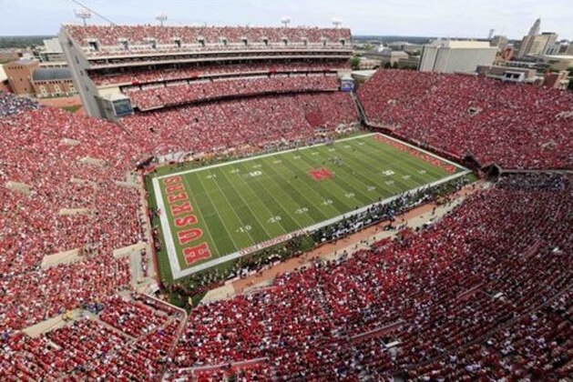 FILE- In this Sept. 5, 2015, file photo, Nebraska fans fill Memorial Stadium during the first half of an NCAA college football game against Brigham Young in Lincoln, Neb. After knocking off an unbeaten Michigan State two games ago, Nebraska gets an opportunity to ruin third-ranked Iowa's perfect record on Friday. Iowa has clinched a spot in the Big Ten championship game, but the Hawkeyes also have playoff hopes, while the Cornhuskers are trying to lock up a bowl bid. (AP Photo/Nati Harnik)