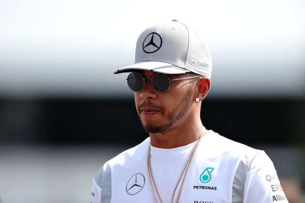 MONZA, ITALY - SEPTEMBER 01:  Lewis Hamilton of Great Britain and Mercedes GP walks into the paddock during previews for the Formula One Grand Prix of Italy at Autodromo di Monza on September 1, 2016 in Monza, Italy.  (Photo by Charles Coates/Getty Images)