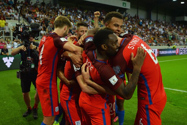 TRNAVA, SLOVAKIA - SEPTEMBER 04:  Adam Lallana of England (obscured) celebrates with team mates as he scores their first goal during the 2018 FIFA World Cup Group F qualifying match between Slovakia and England at City Arena on September 4, 2016 in Trnava, Slovakia.  (Photo by Dan Mullan/Getty Images)