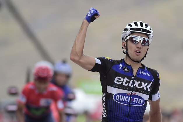 Etixx-Quick Step cyclist Gianluca Brambilla (R) celebrates winning as he crosses the finish line ahead of Movistar's Colombian cyclist Nairo Quintana during the 15th stage of the 71st edition of 'La Vuelta' Tour of Spain, a 120km route Sabinanigo to Formigal, on September 4, 2016. / AFP / JOSE JORDAN        (Photo credit should read JOSE JORDAN/AFP/Getty Images)