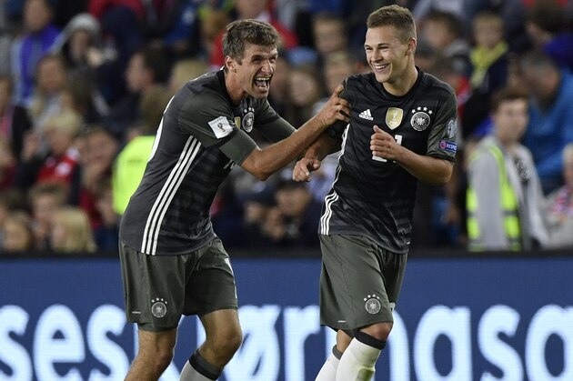 Germany's midfielder Thomas Mueller (L) and Germany's midfielder Joshua Kimmich celebrate after Kimmich scored during  the World Cup 2018 football qualification match between Norway and Germany in Oslo, on September 4, 2015.  / AFP / John MACDOUGALL        (Photo credit should read JOHN MACDOUGALL/AFP/Getty Images)