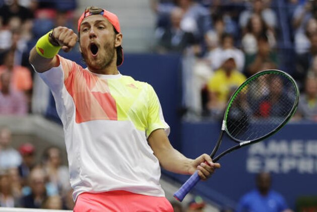 Lucas Pouille, of France, reacts after breaking serve against Rafael Nadal, of Spain, during the fourth round of the U.S. Open tennis tournament, Sunday, Sept. 4, 2016, in New York. (AP Photo/Darron Cummings)