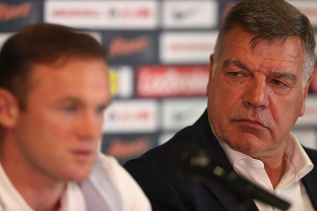 TRNAVA, SLOVAKIA - SEPTEMBER 03:  Manager Sam Allardyce of England listens to Captain wayne Rooney as he talks to the media during the England Press Confernce prior to the FIFA World Cup Qualifying Group F match against Slovakia at City Arena on September 3, 2016 in Trnava, Slovakia.  (Photo by Christopher Lee/Getty Images)