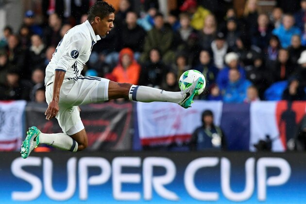 Real Madrid's French defender Raphael Varane controls the ball during the UEFA Super Cup final football match between Real Madrid CF and Sevilla FC on August 9, 2016 at the Lerkendal Stadium in Trondheim. / AFP / JONATHAN NACKSTRAND        (Photo credit should read JONATHAN NACKSTRAND/AFP/Getty Images)