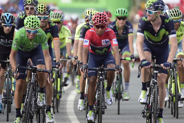Movistar's Colombian cyclist Nairo Quintana (C) and Movistar's Alejandro Valverde (L) ride with the pack before crossing the finish line during the 13th stage of the 71st edition of 'La Vuelta' Tour of Spain, a 212.8km route between Bilbao and Urdax, on September 2, 2016. / AFP / JOSE JORDAN        (Photo credit should read JOSE JORDAN/AFP/Getty Images)